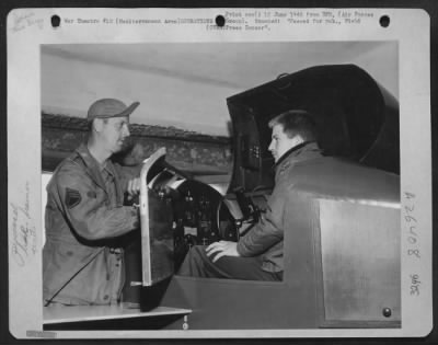 Thumbnail for Consolidated > Night fighter pilots need the link trainer too. S/Sgt. Daniel H. Parish, Towson, Md., shows how to 2nd. Lt. F.F. Weaver, from Dallas, Texas, pilot of the 414th Night Fighter Sqaudron.