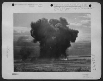 Consolidated > This dense cloud of flame and smoke shows what happens when low-flying planes drop the AAF's new incendiary bomb.