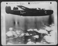 "The Ace of Spades," one of General Kenney's Fifth Air Force Liberator Bombers, soars over Wewak after a devastating attack on a major enemy air base on the North coast of New Guinea. - Page 1