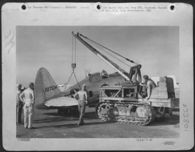 Consolidated > Tail Of Republic P-47 Is Hoisted Into Bore-Sighting Position By Armorers Of The First Air Commando Group Somewhere In India.  Left To Right:  Sgt. Jack M. Kubler, 26 W. Maple St., Allendale, N.J., Cpl. Robert W. Bowers, 947 Cartaret Ave., Trenton, N.J.; L