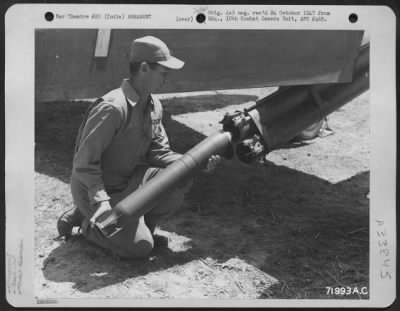 Thumbnail for Consolidated > An Officer Of The 1St Air Commando Group Holds A Projectile To Show Its Size.  7 August 1944.