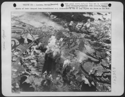 Consolidated > Bursts of bombs dropped from Consolidated B-24 Liberators of the US Army Eight Air Force on the Nazi repair and maintenance base at Kjeller, Norway. This photo clearly shows the nature of the country, with winding rivers, mountains, forests and few