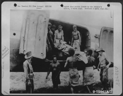 Thumbnail for Consolidated > Native Litter Bearers Assisting Australians And American Soldier In Loading Patient Into Plane For Evacuation From Dumpu, New Guinea, By The 804Th Medical Air Evacuation Transportation Squadron.