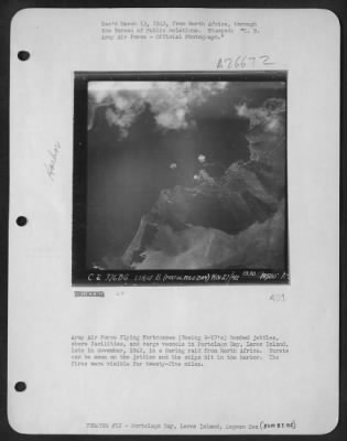 Consolidated > Army Air Force Flying Fortresses (Boeing B-17's) bombed jetties, shore facilities, and cargo vessels in Portolago Bay, Leros Island, late in November, 1942, in a daring raid from North Africa. Bursts can be seen on the jetties and the ships hit in