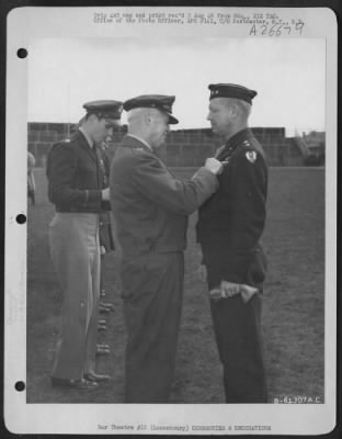Consolidated > General H. H. Arnold Awards Major General O. P. Weyland The Distinguished Service Medal At Ceremonies At Luxembourg, France [Sic] On 7 April 1945.