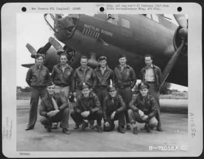 General > A Crew Of The 379Th Bomb Group Poses Beside The Boeing B-17 "Flying Fortress" "Battlin Bobbie" At An 8Th Air Force Base In England.