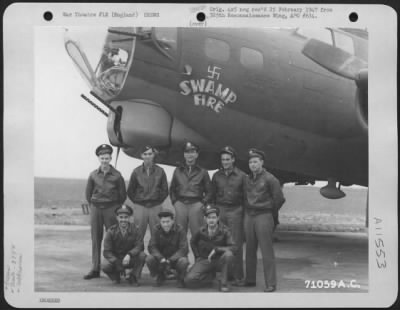 General > A Crew Of The 379Th Bomb Group Poses Beside The Boeing B-17 "Flying Fortress" 'Swamp Fire' At An 8Th Air Force Base In England, 14 March 1944.