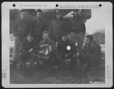General > Lt. Maxwell And Crew Of The Boeing B-17 "Flying Fortress" Of The 390Th Bomb Group Pose By Their Plane At Their Base In England On 26 December 1944.