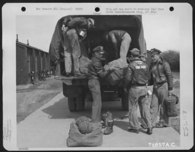 General > After Briefing, Crew Members Of The Boeing B-17 'Swamp Fire' Load The Equipment On A Truck Which Will Take Them To The Flight Line At An 8Th Air Force Base In England.  Soon They And Other Crews Of The 379Th Bomb Group Will Be Roaring Over Enemy Occupied