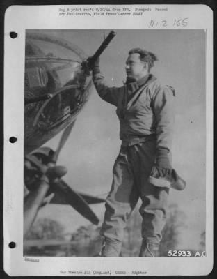 Fighter > Capt. William L. Leirevaag, 308-136 Place, Chicago, Ill., uponn returning from a rough trip to Chiefres, Belgium, stands by the gun with which he downed one Nazi fighter and probably destroyed another. The encounter took place after bombing the target
