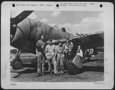 Fighter > Col. Gabreski poses with his ground crew for a picture just after returning from a mission over France. The Col. Is commanding officer of his squadron, is the leading Ace of the USAAF with 28 German planes to his credit. He hold the Air Medal with 3