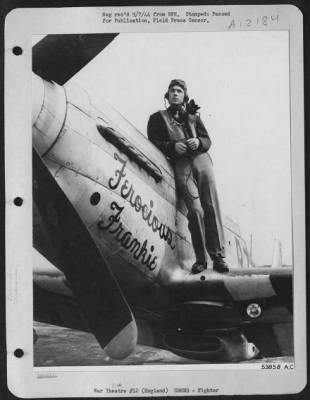 Fighter > ENGLAND-Lt. Col. Wallace E. Hopkins of Washington, Ga., poses on the wing of his North American P-51 Mustang fighter "FEROCIOUS FRANKIE" named for his wife, Mrs. Frankie L. Hopkins. The 25 year old 8th AF Fighter Command Pilot and acting