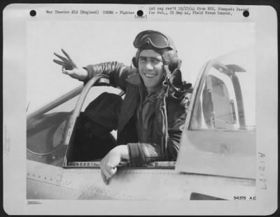 Thumbnail for Fighter > "I got three today," is what Lt. William T. Kemp of 1021 E. Washington St., East Peoria, Ill., is saying as he sticks three fingers in the air on returning to his 8th Fighter Command station in England, today. The North American P-51 Mustang pilot