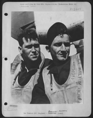 Thumbnail for Gunner > ENGLAND-S/Sgt. John R. Dembecki, Detroit, Mich., upper turret gunner and S/Sgt. Howard H. Cassady, Houston, Miss., tail turret gunner, are shown here after a mission over enemy territory, beside their B-24. Both have 30 missions to their credit