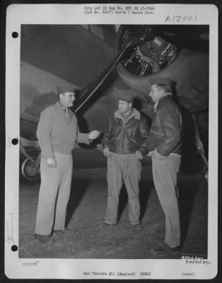 General > At The Warrington Burtonwood Air Depot In England, Capt. W.W. Ott, A Test Pilot, Discusses The Repair Of The Plane In The Background With Its Ground Crew, Pvt. Micheal F. Biagi Of Memphis, Tenn., And Pvt. Jasper P. Howard, Oklahoma City, Okla.  At This Hu