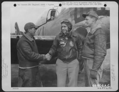 Fighter > Capt. Hurst Talks With Ground Crew Of A North American P-51 Mustang Of The 20Th Fighter Group At An Airbase In England.  Capt. Hurst Is Pilot Of The Plane.