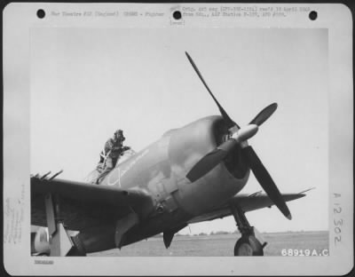 Fighter > Lt. Treitz Of The 351St Fighter Squadron, 353Rd Fighter Group, Steps Into The Cockpit Of His Republic P-47 "Jeannie" Somewhere In England.