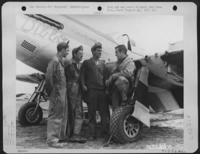 Fighter > Lt. L.V. Andrews And Sgt. L.J. Gold Of The 364Th Fighter Group, Pose In Front Of Their North American P-51 'Passionate Pat' At An 8Th Air Force Base In England.  Sgt. Gold Proudly Holds Their Dog Mascot.  9 February 1945.