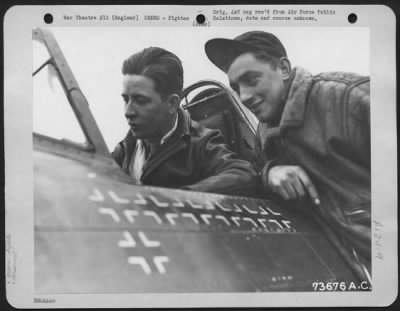 Thumbnail for Fighter > Lt. Duane W. Beeson, Boise, Idaho, An Ace Fighter Pilot, In The Cockpit Of His Republic P-47 At An Air Base In England, Discusses His Latest Mission Over Europe With A Crew Member.  [See 3A-12148 For Photo Of His Hands On The Stick (50476Ac).]