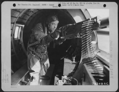 Gunner > S/Sgt. Maynard H. Smith Of Caro, Mich., Ball Turret Gunner On A Boeing B-17 Is Shown In Position On The Plane During A Mission From His Base In England.  Sgt. Smith Received The Congressional Medal Of Honor For His Action On His First Operational Flight W