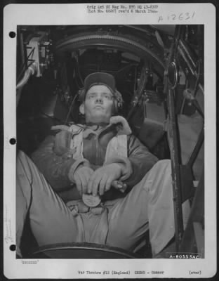 Gunner > T/Sgt. Dale W. Rice Of Greenville Center, N.Y., Top Turret Gunner On A Boeing B-17 Based At Molesworth, England, Is Shown At His Position In The Plane Before Take Off On A Mission.  6 November 1943.