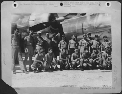 Consolidated > The Ground And Flight Crew Of Boeing B-29 'Enola Gay' After The First Atomic Bombing Mission On Hiroshima, Japan.  Colonel Paul W. Tibbets, The Pilot, Is In The Center Under The Prop, Wearing Shirt And Cap.  Tinian, Marianas Islands.