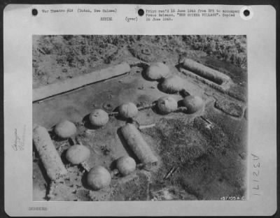 Thumbnail for Consolidated > NEW GUINEA VILLAGE--An Air Transport Command plane flies over a settlement southwest of Hollandia, New Guinea. This is believed to be a typical of the terrain and dwellings where three survivors of an army plane crash are marooned, awaiting rescue.