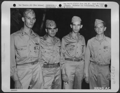 Thumbnail for Consolidated > New assignments in the U.S. loomed for these four pursuit pilots of the 5th Air Force who were among 16 others decorated recently by Lt. General George C. Kenney on the even of their departure from New Guinea. They are (left to right): 1st Lts.