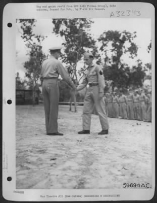 Thumbnail for Consolidated > New Guinea, 15 September 1943, S/Sgt. Gerald R. Zimmerman, Milroy, Pa., being decorated with the Distinguished Flying Cross and the  Air Medal by Brig. General Roger Ramey. S/Sgt. Zimmerman flies as gunner on a Consolidated B-24 Liberator bomber