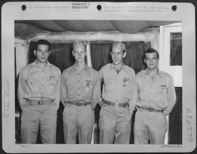 Consolidated > New Guinea. These four pursuit pilots were decorated during a presentation ceremony in New Guinea. Left to right: 1st Lt. Richard T. Cella, N.Y., N.Y., Air Medal ; 1st Lt. John C. Dunbar, Braddock, Pa., Distinguished Flying Cross; 1st Lt. Lee C.