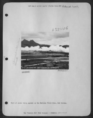Consolidated > Shot of the smoke being spread on the Bellows Field line, New Guinea.