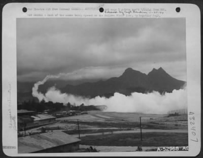 Consolidated > NEW GUINEA-Shot of the smoke being spread on the Bellows Field line, by Republic P-47.