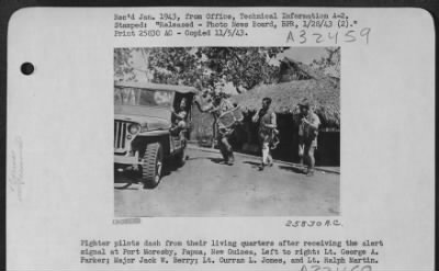 Thumbnail for Consolidated > Fighter pilots dash from their living quarters after receiving the alert signal at Port Moresby, Papua, New Guinea, Left to right: Lt. George A. Parker; Major Jack W. Berry; Lt. Curran L. Jones, and Lt. Ralph Martin.