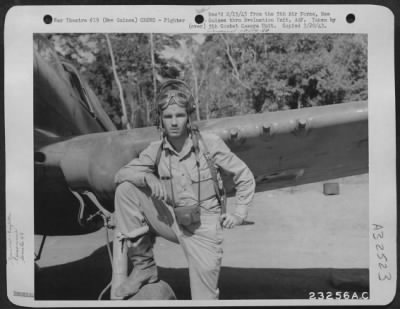 Consolidated > Joe King of the 49th Fighter Group beside his plane at an air base somewhere in New Guinea.