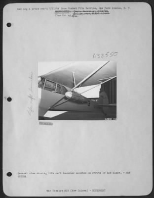 Thumbnail for Consolidated > General view showing life raft launcher mounted on struts of lab plane.-NEW GUINEA