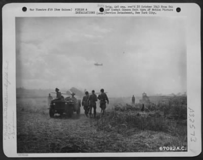 Thumbnail for Consolidated > Even though engineers are still working on construction of Nadzab Airstrip in New Guinea, a Douglas C-47 has landed on the strip and another circles overhead.