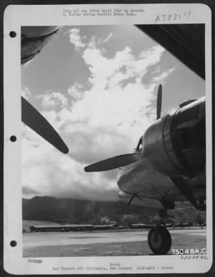 Thumbnail for Consolidated > Engines And Nose Of Douglas C-54 Form A Frame For The Beautiful Cloud Formation At Hollandia, New Guinea.  29 April 1945.