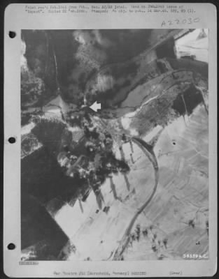 Consolidated > Bombs dropped by 8th AF erupt on road junction and rail bridge at Morscheid, southeast of Trier, Germany, 25 Dec. 1944.
