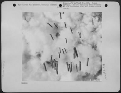 Thumbnail for Consolidated > Falling rapidly toward the clouds and the earth below, these bombs from Boeing B-17 "Flying Fortresses" that raided Munster, Germany, on 11 November 1943, caused sufficient destruction to disrupt the German communications in the city.