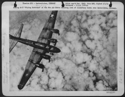 Thumbnail for Consolidated > Boeing B-17 "Flying Fortress" of the 8th Air Force releasing load of incendiary bombs over Oscherleben, Germany.