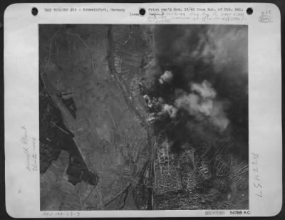 Consolidated > ON THE RIGHT BEARINGS-These photos released by Eighth Air Force Bomber Command headquarters today show the huge Schweinfurt Ball and Roller Bearings factory area blanketed by bombs from Flying Fortresses in their great attack of October 14th in
