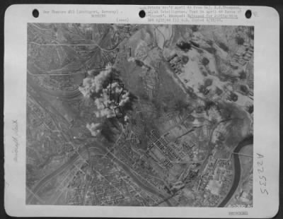Consolidated > Stuttgart Ball Bearing Works, Stuttgart, Germany. During bombing-Smoke bomb is no longer visible as one-hundred-pound incendiaries send up plumes of their own. Fifty heavies made the attack on 25 Feb 44, hit machine shop, finishing shop, and office