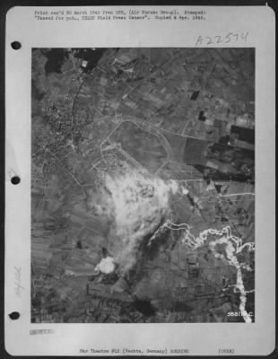 Consolidated > Clouds of dense smoke obscure hangars and workshops at Vechta airdrome 24 Mar 45 as U.S. 8th AF heavy bombers pressed home their attack. This was part of the assault to neutralize the Luftwaffe while troop carriers and transports dropped paratroops