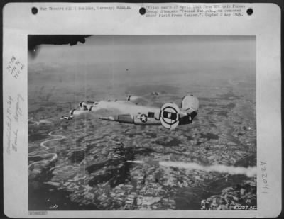 Consolidated > Bombs Away -- Missiles For The Transportation Facilities Of Muhldorf, Germany Go Down From A Consolidated B-24 Liberator.