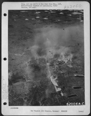 Consolidated > Bombing Attack On Railroad Yards At Munich, Germany, By Consolidated B-24 Liberators Of The 15Th Af, 4 Oct. 1944.  The Target Is Partially Obscured By Smoke Screen As A Formation Of B-24S Approaches To Drop Its Bombs.