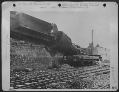 Consolidated > One Of The Many Overturned Engines And Uprooted Rails Which Advancing Allied Armies Found At The Railway Marshalling Yards At Munster, Germany.