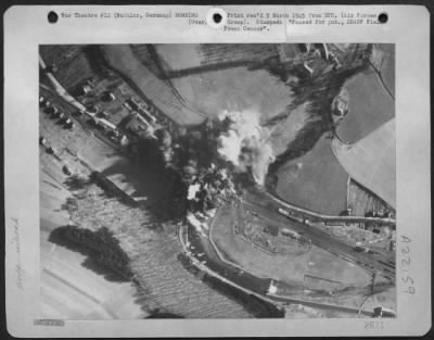 Consolidated > Well Developed Bomb Bursts Pattern A Railroad Bridge And Adjacent Highway Span At Nuttlar, Germany Near Bestwig, Following An Attack By 9Th Bombardment Division Martin B-26 Marauders Feb. 22 1945.  Direct Hits Were Scored On The Railroad Bridge.