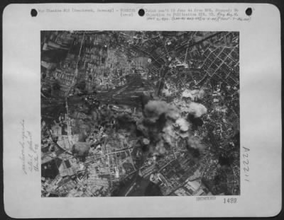 Consolidated > Forts Maul Rail Center -- Bombs From Boeing B-17 Flying Fortresses Strike The Marshalling Yards At Osnabruck As Us 8Th Aaf Heavies Attacked 13 May 44.  Smoke From A Nearby Steel Plant Can Be Seen Rising As The American Bombs Take Their Toll.  Hits Were Al