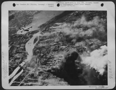 Consolidated > The Vital Nazi Oil Refineries At Politz, Germany Were Hit  By Formations Of Heavy Bombers Of The 8Th Air Force On June 20, 1944. A Large Cloud Of Oily Black Smoke Curls Its Way Heavenward As The Effect Of The Unleashing Of The Lethal Load Is Felt On The T
