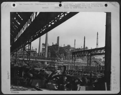 Thumbnail for Consolidated > The Saarbrucken Engineering Plant As Seen From A Machine Plant, After Being Practically Destroyed By Bombs From The Us 8Th Af.  300,000 Tons Of Coal, Stored Beneath Parts Of The Plant, Caught Fire During The October 1944 Attack And Is Still Burning.